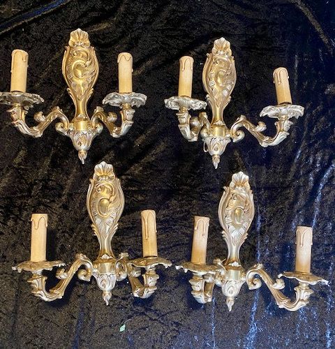 a set of four brass french walllights