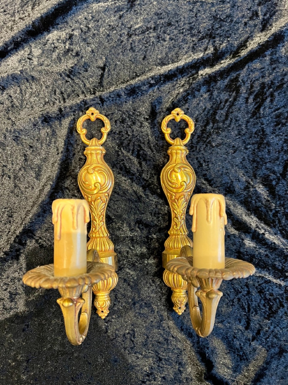 a pair of single light brass french antique walllights