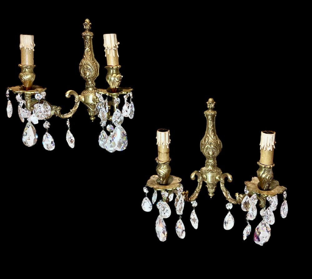 a pair of stunning two light french gilt brass and crystal antique walllights